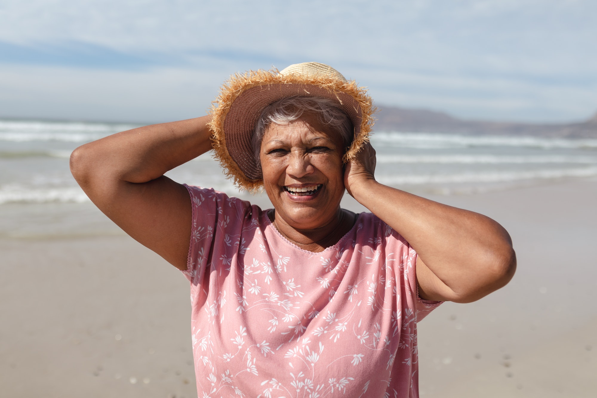 Portrait of senior african american woman smiling on the beach